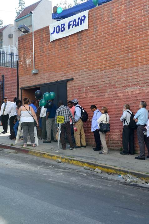 Job Fair Downtown L.A. — job seekers lined up outside brick building